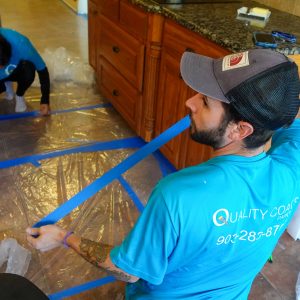 Floor masking Some of our painters masking off a floor before painting. East Texas Painters