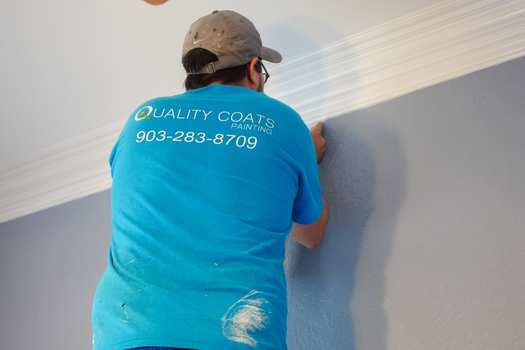 One of our employees, Paul Miller painting the crown molding on a interior painting job we did in Lindale, TX. We are house painters you can trust.